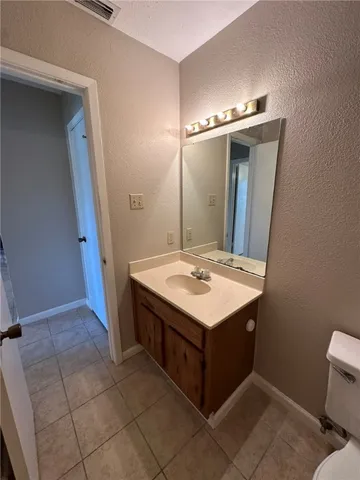 a kitchen with stainless steel appliances a stove a sink and a refrigerator
