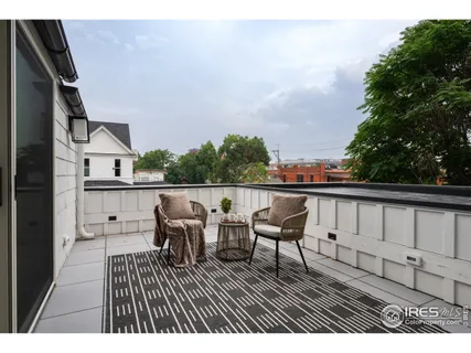 a view of roof deck with patio