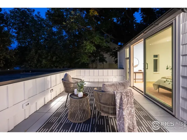 a view of balcony with furniture
