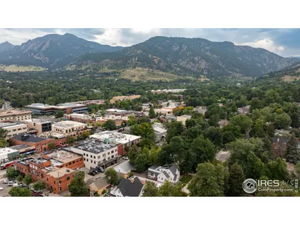 a view of a city with mountains in the background