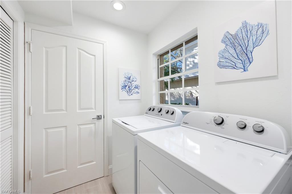 2806 Aintree Lane, Unit H102 Naples, FL 34112 - Photo 20 of 26 Laundry area with washing machine and dryer and recessed lighting