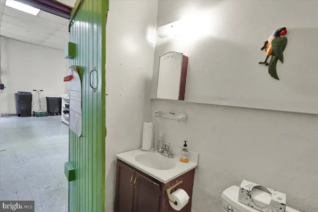 a storage room with lots of furniture and clutter