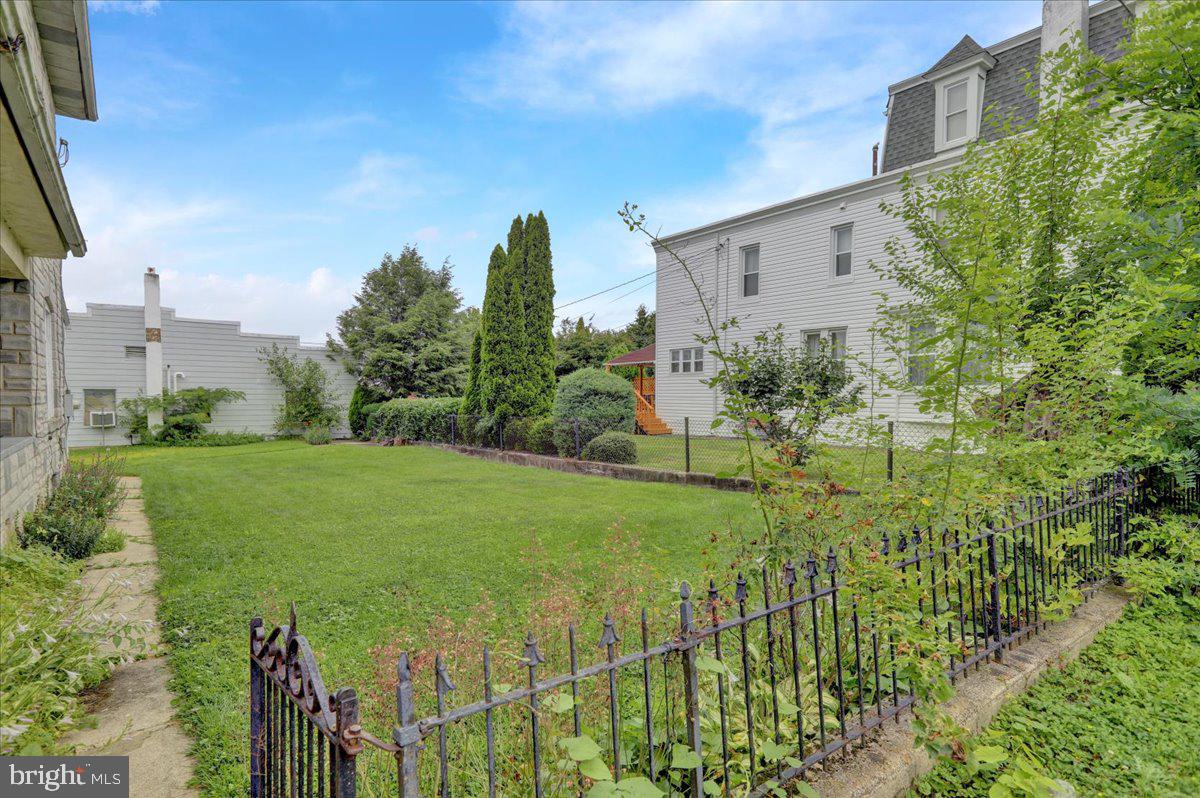 529 Chestnut Street West Reading, PA 19611 - Photo 6 of 29 a view of a garden with a building in the background