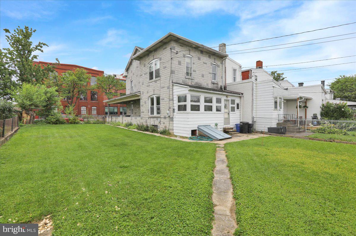 529 Chestnut Street West Reading, PA 19611 - Photo 7 of 29 a front view of a house with a yard table and chairs