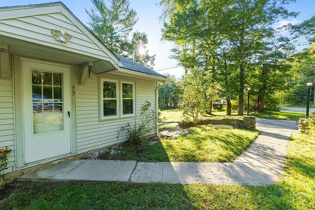 75 Main Road Phillipston, MA 01436 - Photo 4 of 27 a view of a house with backyard and sitting area