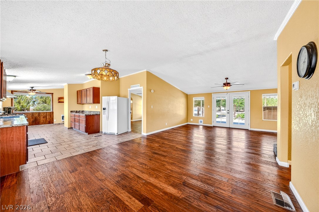 1831 West Horn Road Pahrump, NV 89048 - Photo 55 of 59 An inviting open floorplan featuring gleaming hardwood floors and French doors opening to outdoor spaces.