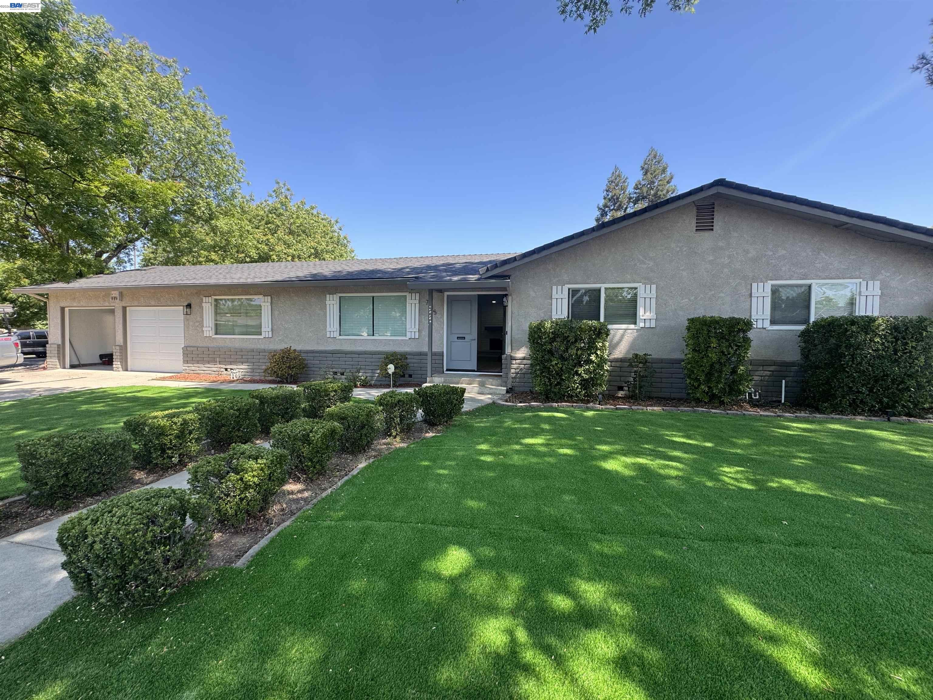 705 West Rumble Road Modesto, CA 95350 - Photo 1 of 17 a view of a yard in front of house