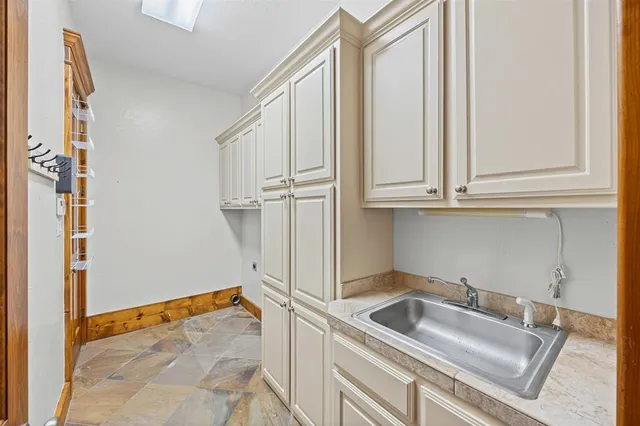 a bathroom with a sink and washing machine