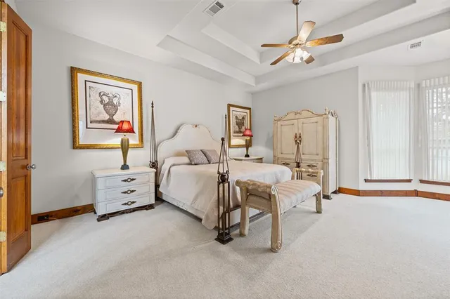 a bed room with a bed and a chandelier