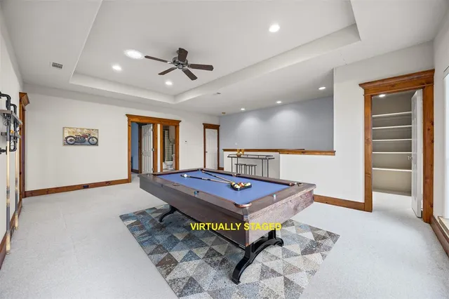 a view of a room with furniture and window