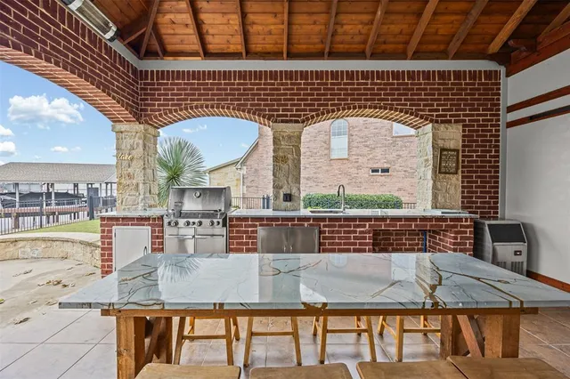 a view of pool table and chairs
