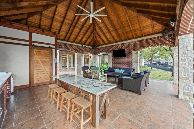 a view of a patio with a table and chairs