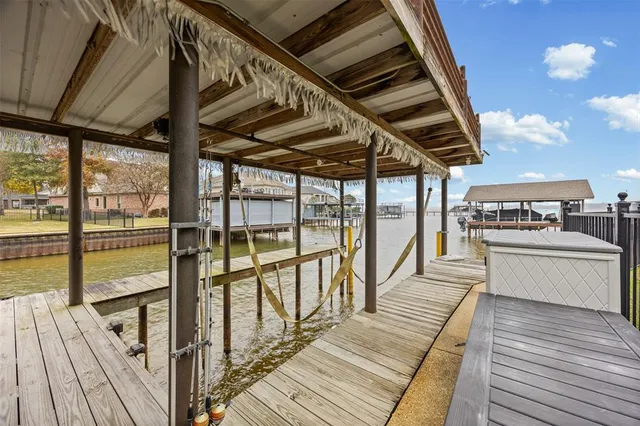 a view of a balcony with wooden floor