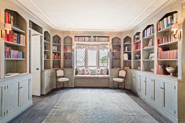 a view of a dining room with furniture wooden floor and chandelier