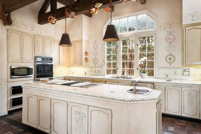 a living room with furniture and a glass door
