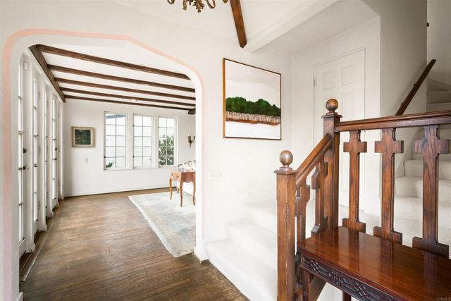 a bathroom with a tub a sink and a large mirror