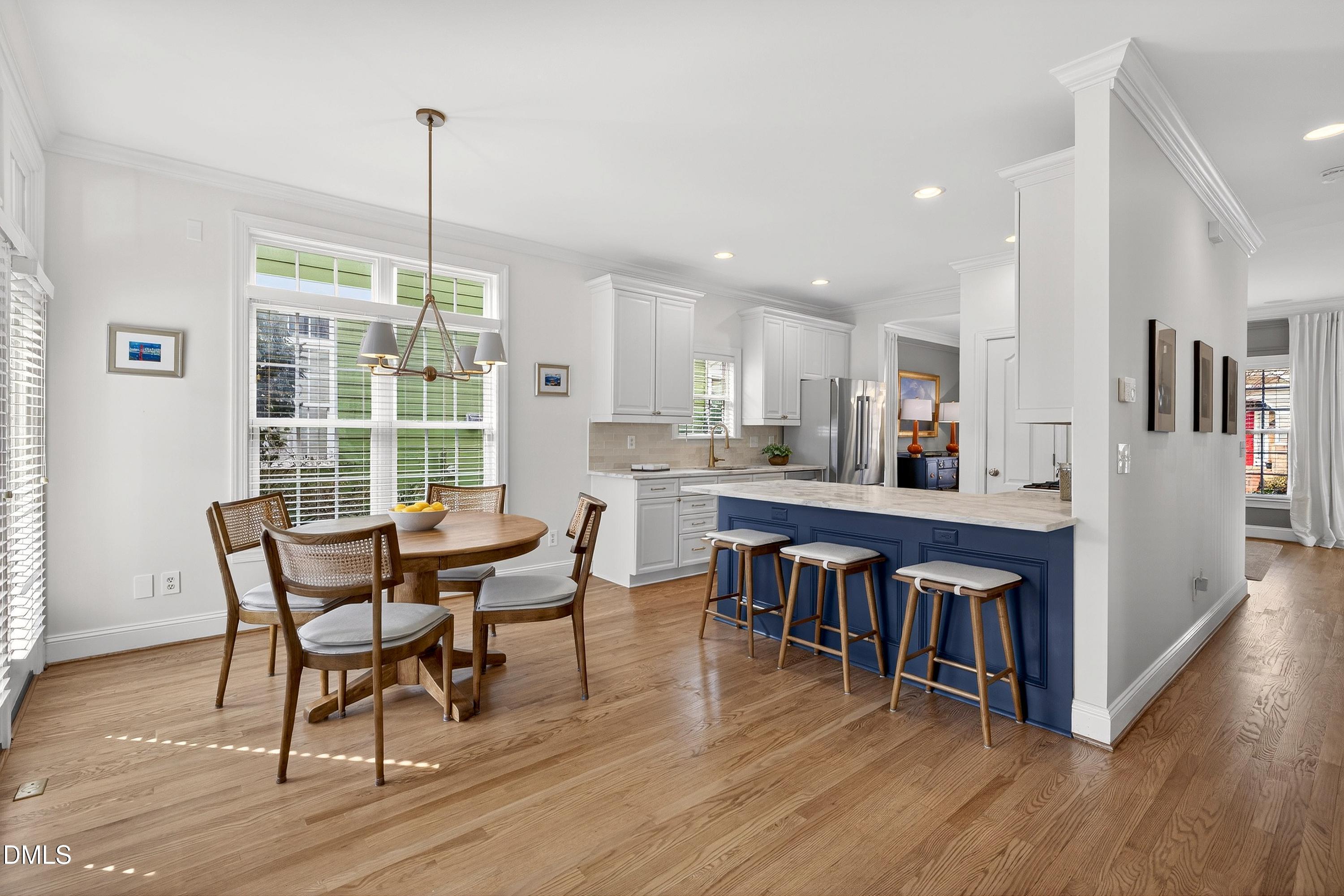 1168 Harp Street Raleigh, NC 27604 - Photo 17 of 45 a view of a dining room with furniture window and wooden floor
