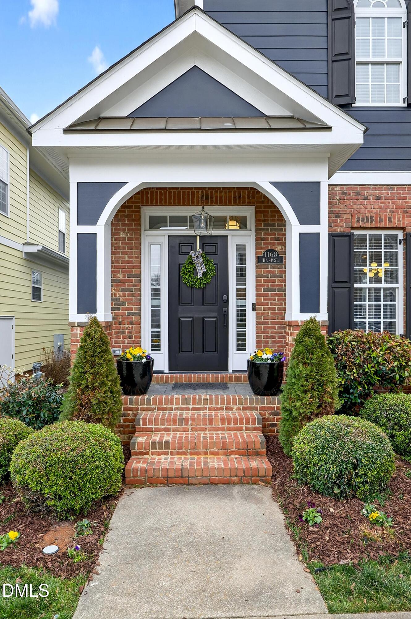 1168 Harp Street Raleigh, NC 27604 - Photo 3 of 45 a front view of a house with garden