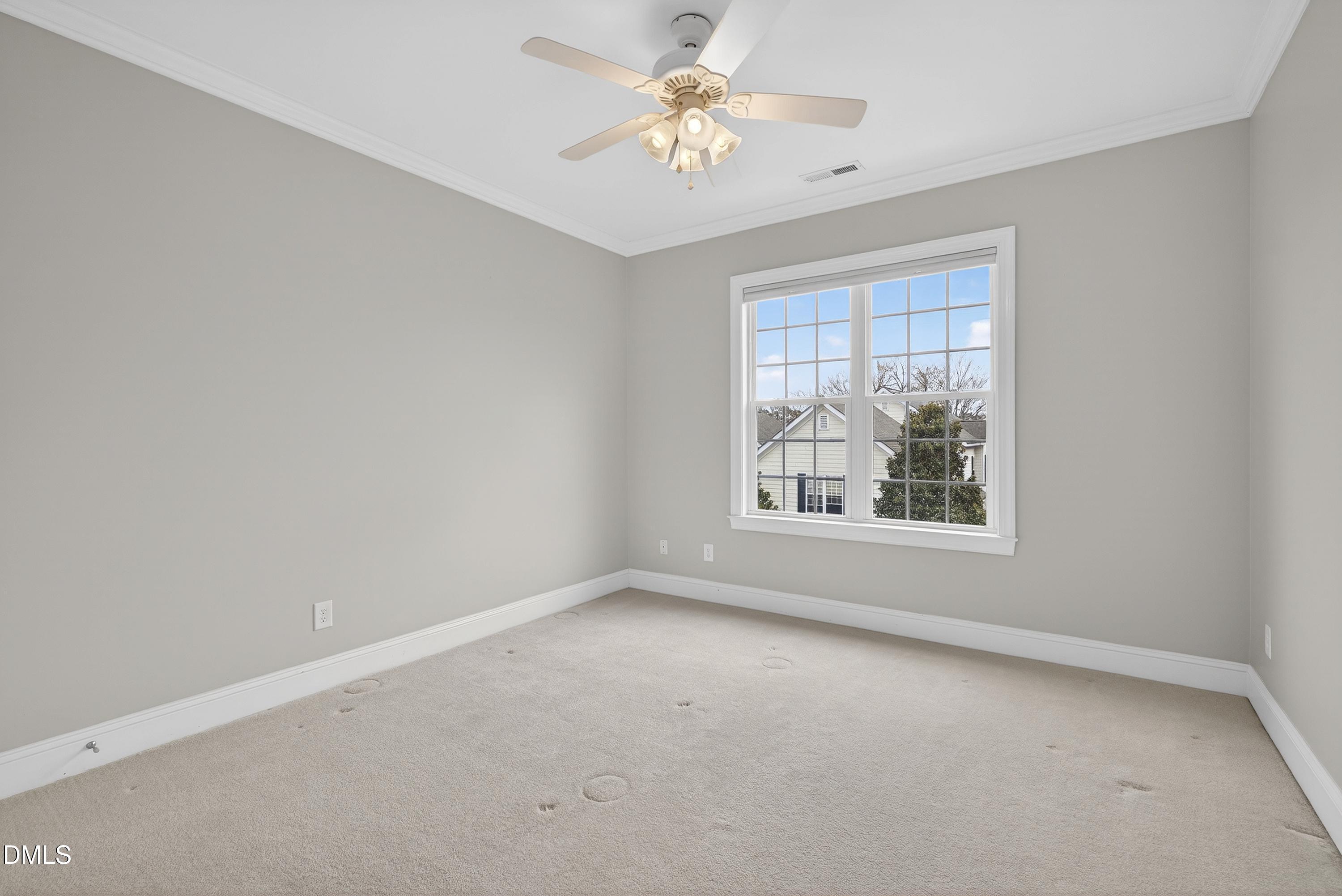 1168 Harp Street Raleigh, NC 27604 - Photo 32 of 45 an empty room with a window and a fan