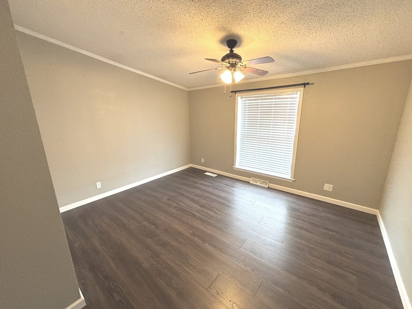 4120 Bannister Road Salem, IL 62881 - Photo 15 of 20 a view of an empty room with wooden floor and a window