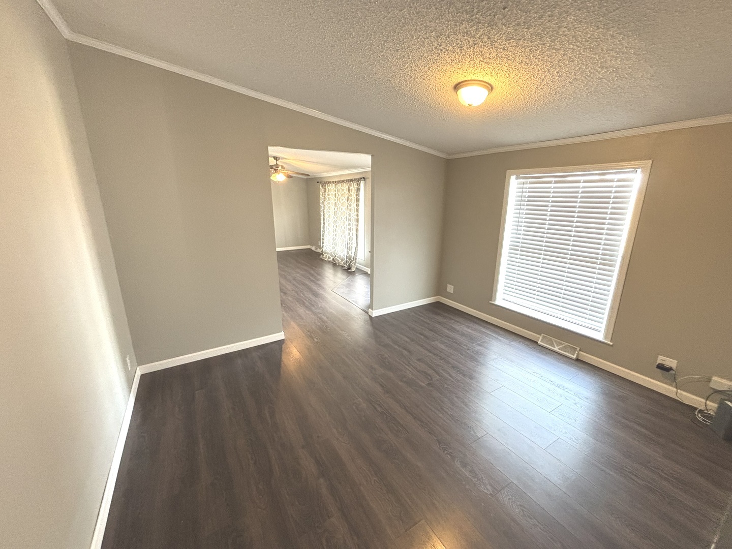4120 Bannister Road Salem, IL 62881 - Photo 3 of 20 an empty room with wooden floor and windows