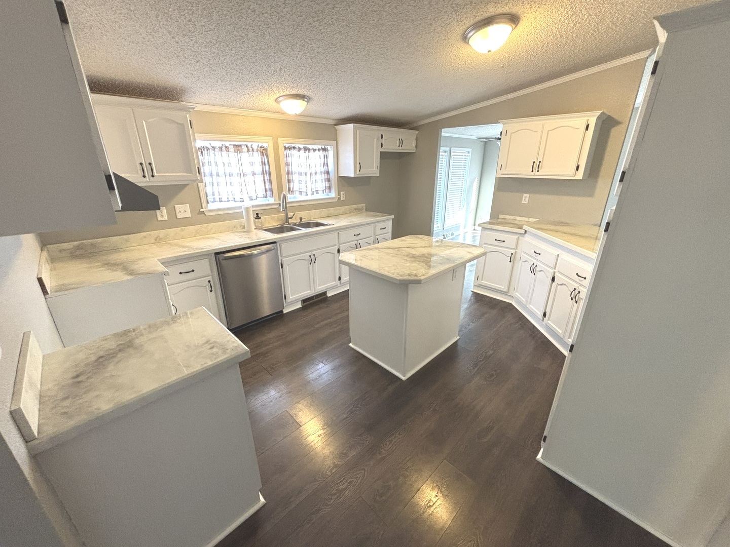 4120 Bannister Road Salem, IL 62881 - Photo 5 of 20 a open kitchen with a sink stove and white cabinets
