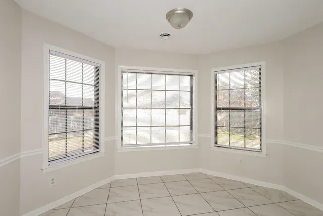 an empty room with windows