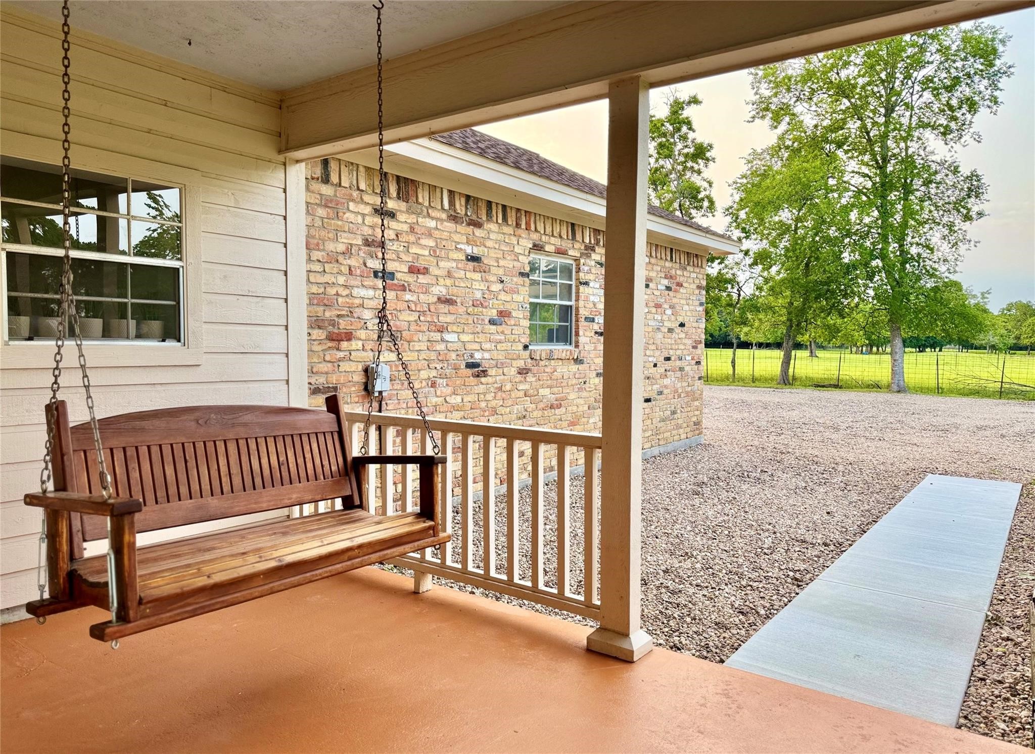 22035 Buescher Road Tomball, TX 77377 - Photo 12 of 44 a view of a porch with a yard