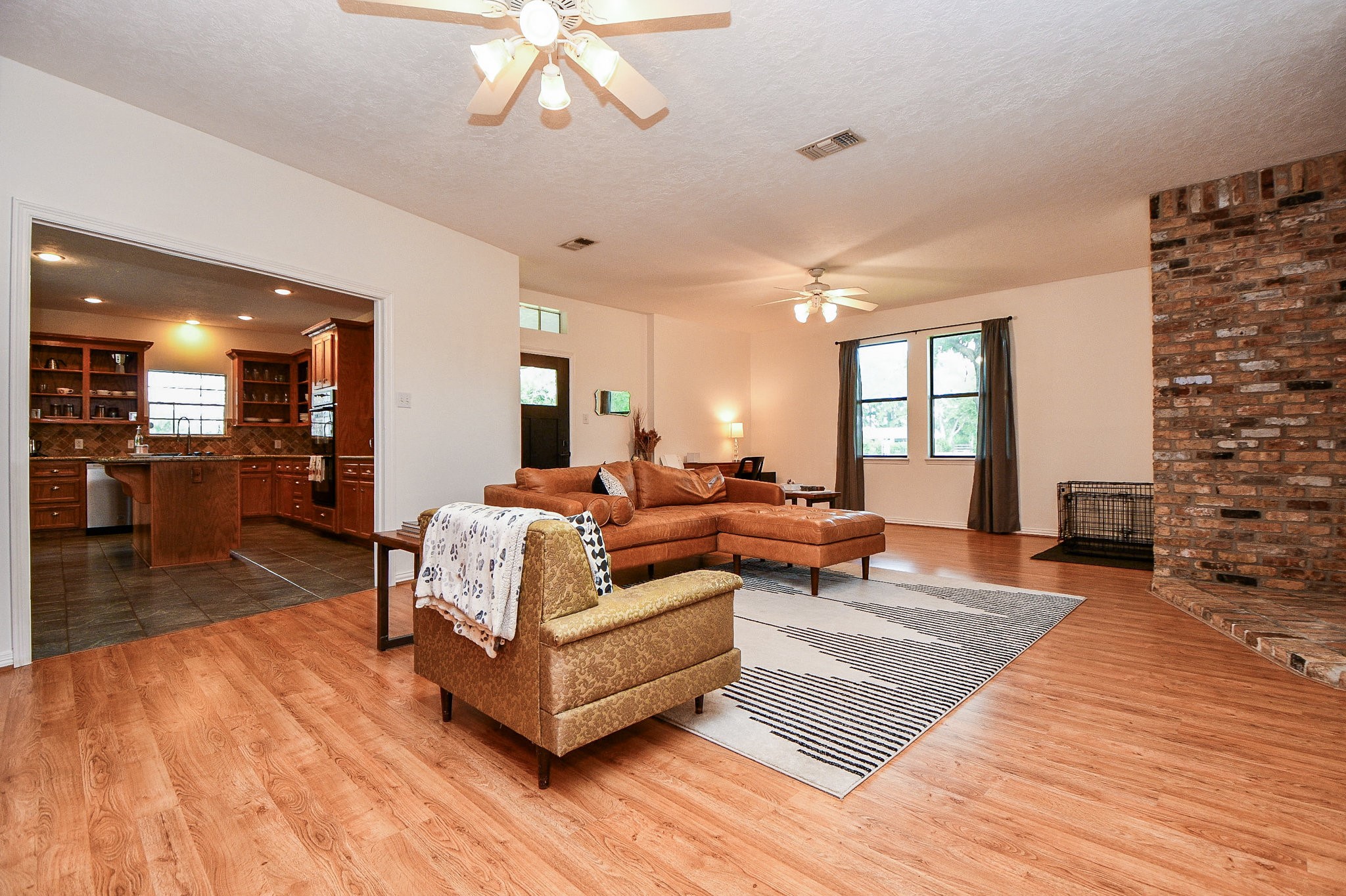 22035 Buescher Road Tomball, TX 77377 - Photo 13 of 44 a living room with furniture and a wooden floor
