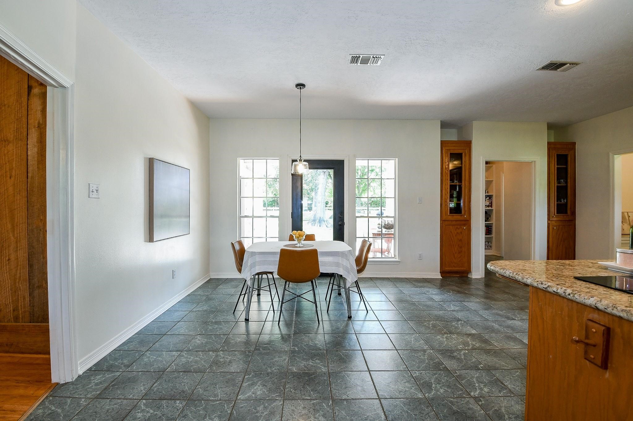 22035 Buescher Road Tomball, TX 77377 - Photo 17 of 44 a dining room with furniture and window