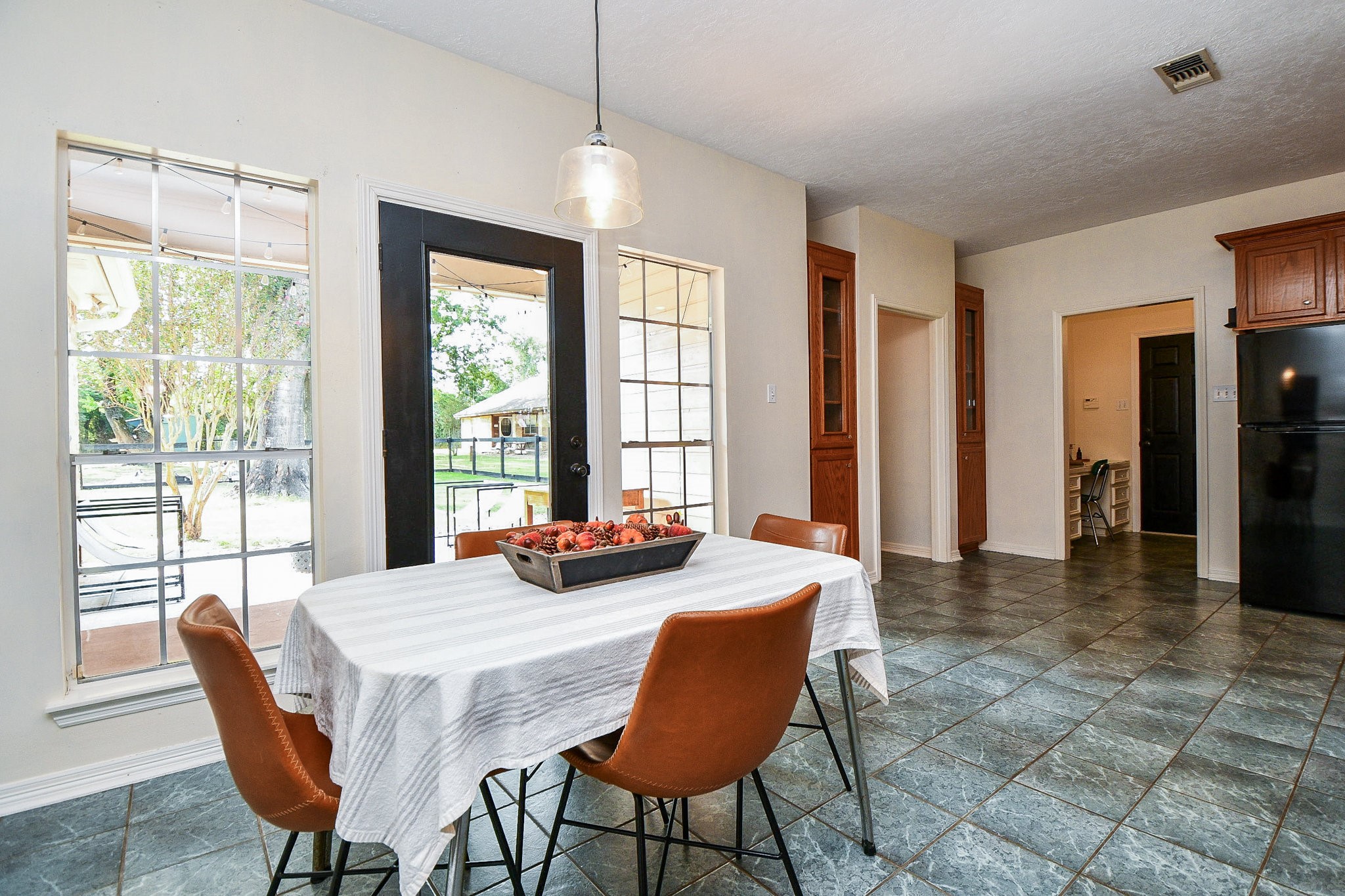 22035 Buescher Road Tomball, TX 77377 - Photo 18 of 44 a view of a a dining room with furniture window and wooden floor