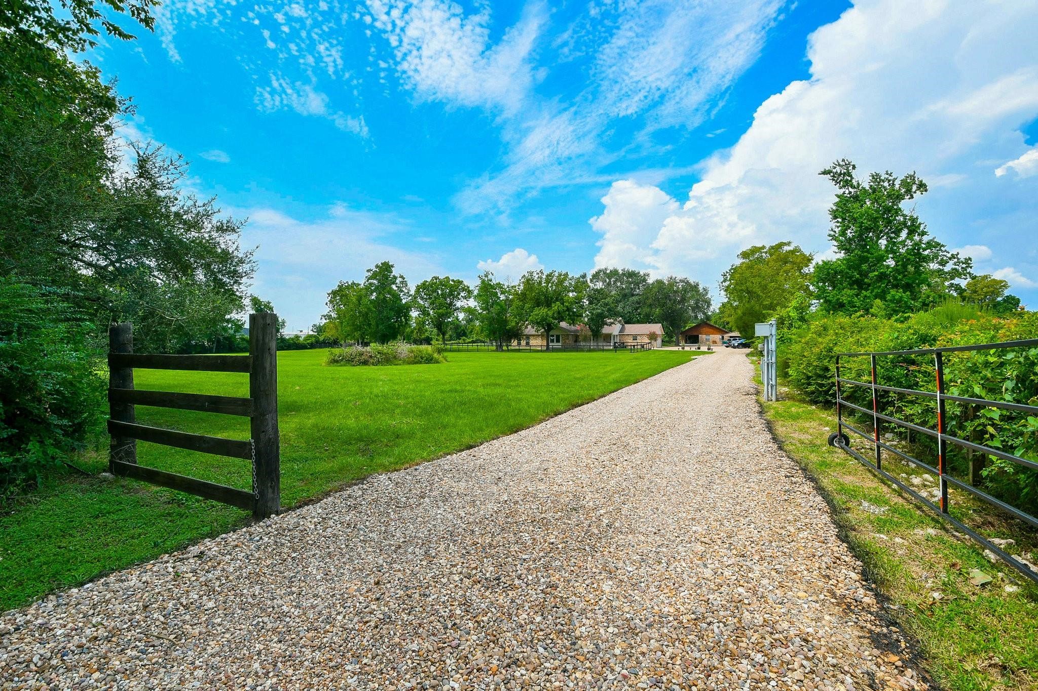 22035 Buescher Road Tomball, TX 77377 - Photo 2 of 44 a view of a garden with wooden fence