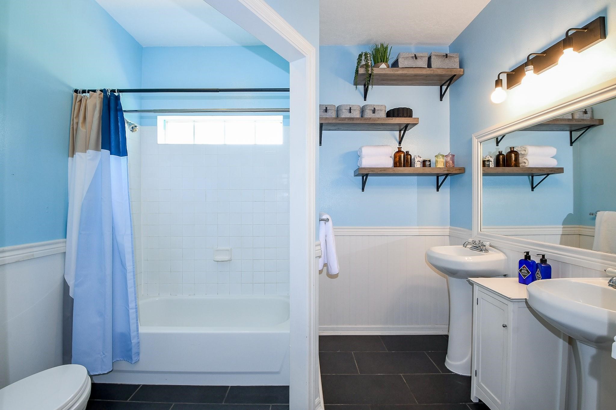 22035 Buescher Road Tomball, TX 77377 - Photo 28 of 44 a bathroom with a sink toilet and shower