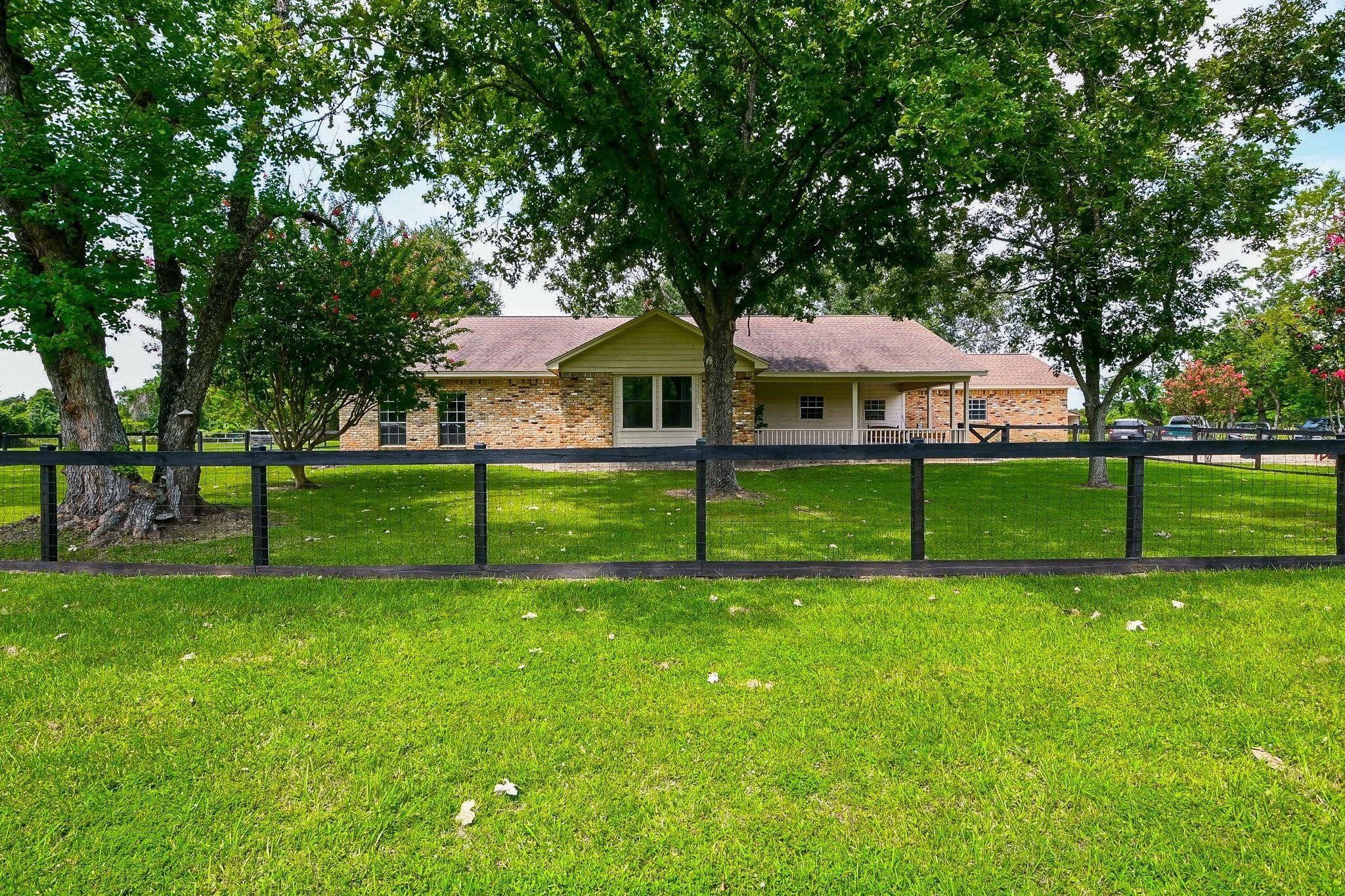 22035 Buescher Road Tomball, TX 77377 - Photo 3 of 44 a view of a house with a yard porch and sitting area