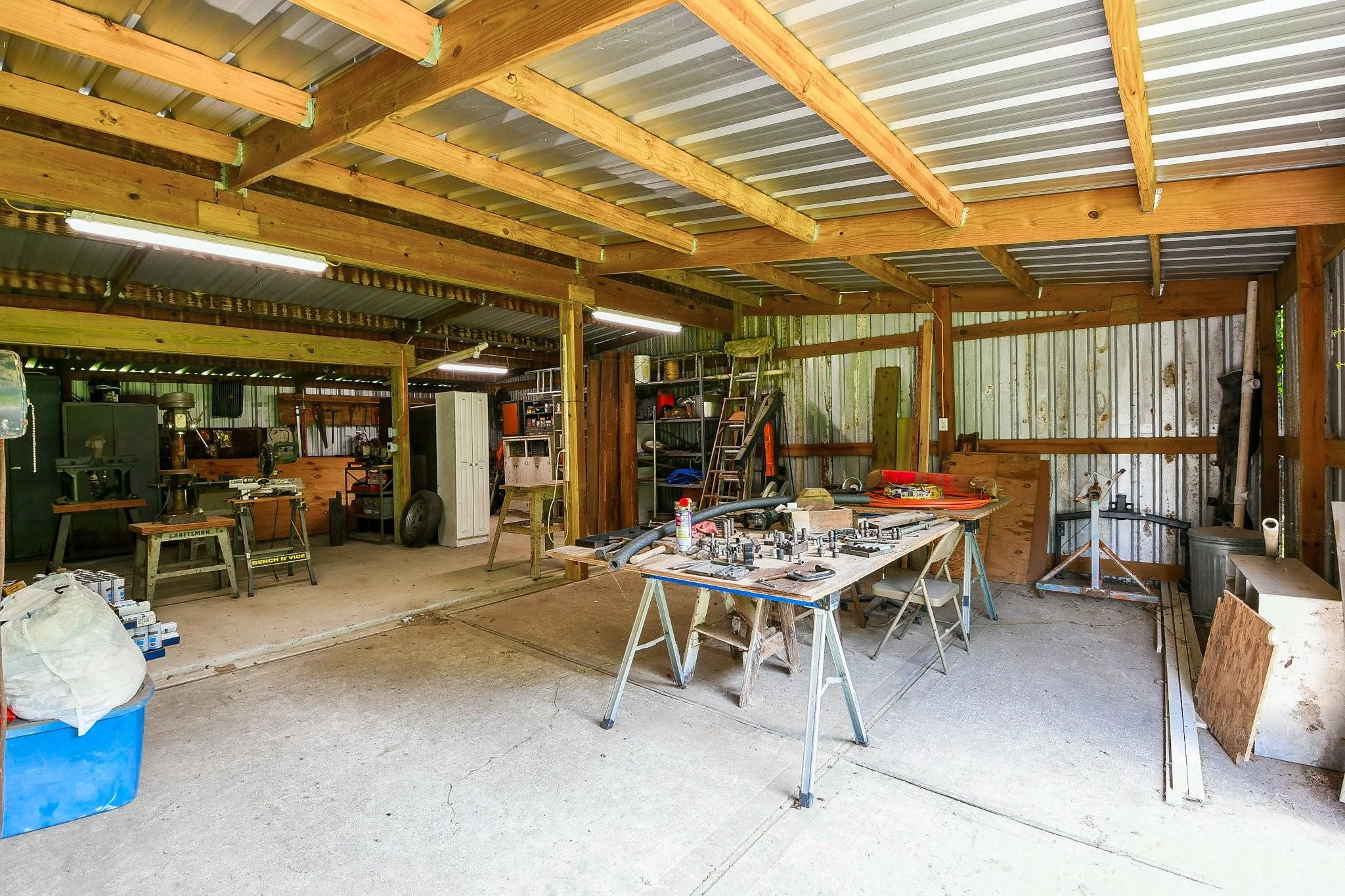 22035 Buescher Road Tomball, TX 77377 - Photo 9 of 44 a view of a dinning table and chairs in the patio