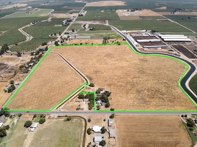 a view of a swimming pool with a yard