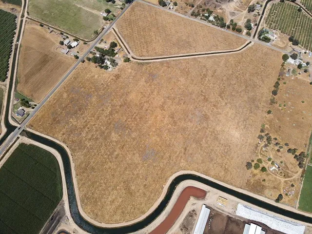 a view of house with outdoor space and trees around