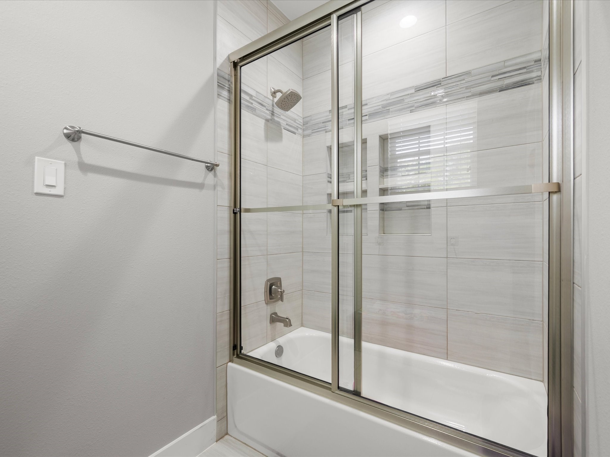 6207 Graff Net Court Spring, TX 77379 - Photo 30 of 48 The shared bathroom includes a tub and shower combination with beautiful finishes and thoughtful design.