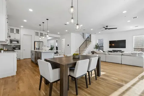 a view of a dining area with furniture and wooden floor