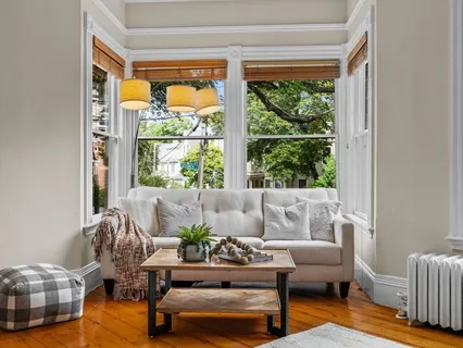a living room with furniture and a window