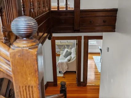 a room with wooden floor and furniture