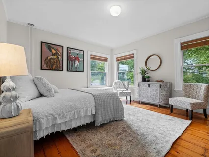 a bedroom with bed and a couch