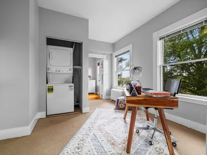 a living room filled with furniture and a table