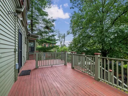 an aerial view of a house with garden space and street view