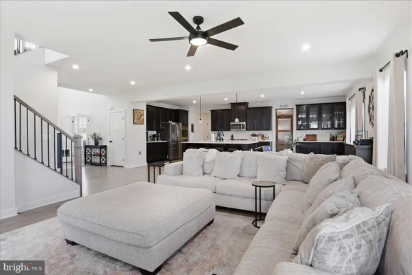 a kitchen with kitchen island a sink table and chairs