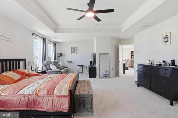 a view of walk in closet with clothes
