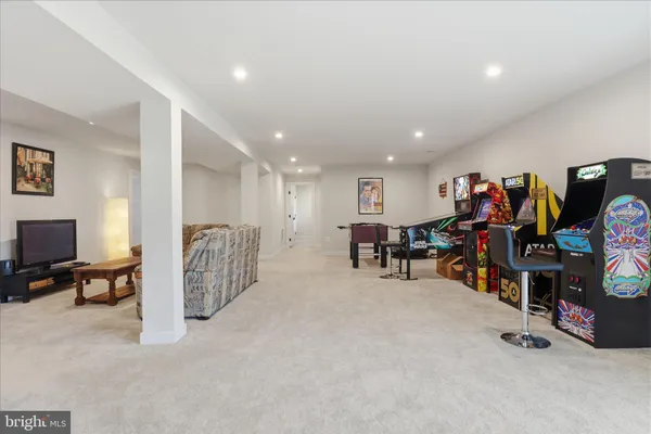 a bedroom with a bed and a tv