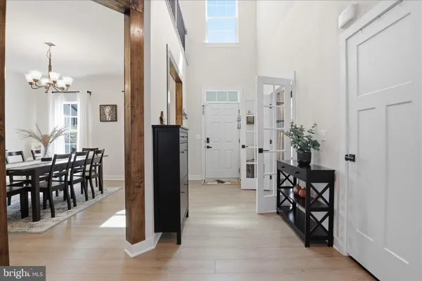 a view of a livingroom with workspace and a window