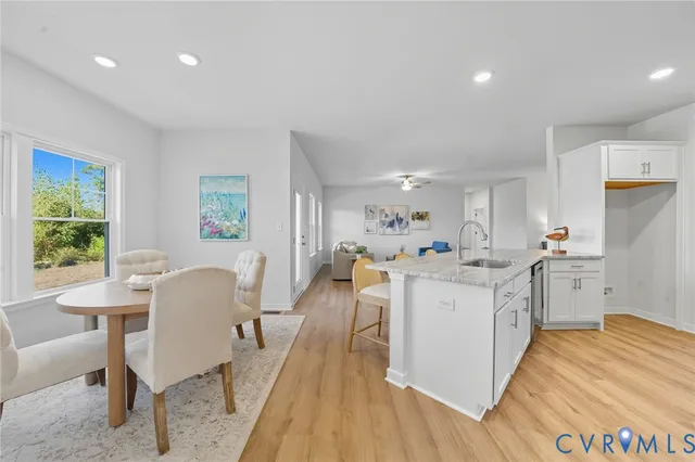 a view of entryway livingroom and hall with wooden floor