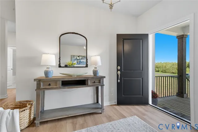 a view of a a dining room with furniture and wooden floor